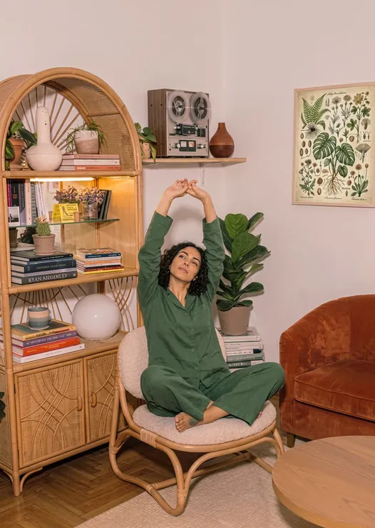Woman doing yoga in cozy room